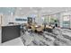 Chic lounge with comfortable seating, entertainment options, and refreshing pool views at 301 Quay Commons # 1709, Sarasota, FL 34236