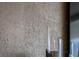 Textured gray wall with subtle pattern, creating a modern, sophisticated look at 301 Quay Commons # 1709, Sarasota, FL 34236