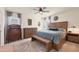 Relaxing bedroom featuring natural wood furniture, soft carpet, and plenty of natural light at 309 Blue Point Dr, Ruskin, FL 33570
