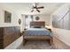 Cozy bedroom with natural wood furniture, overhead lighting, and neutral color scheme at 309 Blue Point Dr, Ruskin, FL 33570
