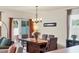 Cozy dining area featuring a modern chandelier and sliding door access to the outside at 309 Blue Point Dr, Ruskin, FL 33570