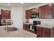 The kitchen boasts sleek countertops, stainless steel appliances, and ample cabinet space at 309 Blue Point Dr, Ruskin, FL 33570