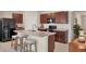 Spacious kitchen with a large island, stainless steel appliances, and ample cabinet space at 309 Blue Point Dr, Ruskin, FL 33570