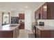 The kitchen boasts sleek countertops, stainless steel appliances, and ample cabinet space at 309 Blue Point Dr, Ruskin, FL 33570