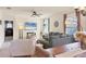 Inviting living room featuring comfortable seating, a large television, and stylish decor at 309 Blue Point Dr, Ruskin, FL 33570
