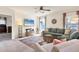 Comfortable living room with a plush sectional sofa, area rug, and lots of natural light at 309 Blue Point Dr, Ruskin, FL 33570
