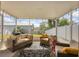 Enclosed patio with comfortable seating and string lights for ambiance at 309 Blue Point Dr, Ruskin, FL 33570