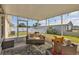 Inviting covered patio with cozy seating and outdoor views at 309 Blue Point Dr, Ruskin, FL 33570