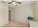 Bedroom featuring a ceiling fan, neutral carpet, and plant at 311 Cape Harbour Loop # 108, Bradenton, FL 34212