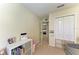 Bedroom featuring neutral carpet, closet, and door leading to another room at 311 Cape Harbour Loop # 108, Bradenton, FL 34212