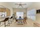 Bright dining area with a modern table, ceiling fan, and natural light streaming through the windows at 311 Cape Harbour Loop # 108, Bradenton, FL 34212