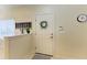 Bright entryway featuring a clean white door with wreath, tile flooring and modern decor at 311 Cape Harbour Loop # 108, Bradenton, FL 34212
