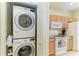 Convenient laundry area located near the kitchen, featuring a stackable washer and dryer at 311 Cape Harbour Loop # 108, Bradenton, FL 34212