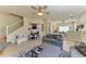 Spacious living room with stairs, neutral tones, open layout, and connection to the dining area at 311 Cape Harbour Loop # 108, Bradenton, FL 34212