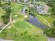 Picturesque golf course community with lush greenery, ponds, and well-maintained fairways at 3130 Ringwood Mdw # 44, Sarasota, FL 34235