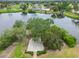 An aerial view of the pond and surrounding community at 3130 Ringwood Mdw # 44, Sarasota, FL 34235