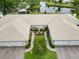 Aerial view of homes with tile roofs showcasing landscaped front entrances at 3130 Ringwood Mdw # 44, Sarasota, FL 34235