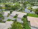 Stunning aerial view of a lakeside community featuring lush landscaping and pristine waterways at 3130 Ringwood Mdw # 44, Sarasota, FL 34235