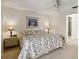 Primary bedroom features a queen bed, ceiling fan, ensuite access and a window at 3130 Ringwood Mdw # 44, Sarasota, FL 34235
