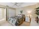 Bedroom featuring carpet, a queen bed and double-door closet at 3130 Ringwood Mdw # 44, Sarasota, FL 34235