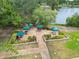 Aerial view of community picnic area, with picnic tables and lush green landscaping at 3130 Ringwood Mdw # 44, Sarasota, FL 34235