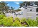 Welcome sign to Papillon community with beautiful landscaping and views of community homes at 3130 Ringwood Mdw # 44, Sarasota, FL 34235