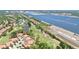 Aerial view of community homes with golf course and long lake views at 3412 E Chelmsford Ct # 42, Sarasota, FL 34235