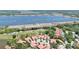 Aerial shot of community with lake and green golf course views at 3412 E Chelmsford Ct # 42, Sarasota, FL 34235
