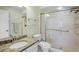 Bathroom featuring granite vanity, toilet, and glass enclosed shower at 3412 E Chelmsford Ct # 42, Sarasota, FL 34235