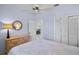 Comfortable bedroom features a ceiling fan, natural light, and ample closet space at 3412 E Chelmsford Ct # 42, Sarasota, FL 34235