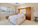 Bedroom features a bed, built-in storage, and natural light from the window at 3412 E Chelmsford Ct # 42, Sarasota, FL 34235