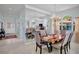 Elegant dining room boasts chandelier lighting and views into the kitchen at 3412 E Chelmsford Ct # 42, Sarasota, FL 34235
