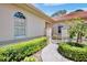Close up on a walkway with decorative metal gate, surrounded by greenery at 3412 E Chelmsford Ct # 42, Sarasota, FL 34235