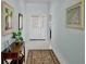 Welcoming foyer featuring tile floors and neutral walls at 3412 E Chelmsford Ct # 42, Sarasota, FL 34235
