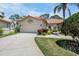 Charming home showcasing a lush, well-manicured lawn and red-tiled roof at 3412 E Chelmsford Ct # 42, Sarasota, FL 34235