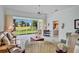 Bright living room features large windows with golf course views and comfortable seating at 3412 E Chelmsford Ct # 42, Sarasota, FL 34235