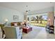 Spacious living room featuring tile floors, neutral paint, and views of back yard at 3412 E Chelmsford Ct # 42, Sarasota, FL 34235