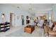 Cozy living room featuring neutral paint, tile floors, and views of dining room at 3412 E Chelmsford Ct # 42, Sarasota, FL 34235