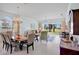 Bright living room featuring tile floors, neutral paint, and views of back yard at 3412 E Chelmsford Ct # 42, Sarasota, FL 34235