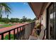 Balcony with beautiful neighborhood views, seating area and lush greenery at 3420 Wild Oak Bay Blvd # 120, Bradenton, FL 34210