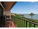 Outdoor balcony featuring lush landscaping and views of the water and nearby grassy areas at 3420 Wild Oak Bay Blvd # 120, Bradenton, FL 34210