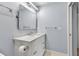 Well-lit bathroom features a white vanity with a marble countertop and a modern mirror at 3420 Wild Oak Bay Blvd # 120, Bradenton, FL 34210