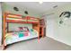 Bright bedroom showcases wood bunk beds and decorative wall art at 3420 Wild Oak Bay Blvd # 120, Bradenton, FL 34210