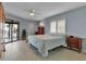 Bedroom featuring tiled floors, closet and sliding glass doors leading to the outdoor balcony at 3420 Wild Oak Bay Blvd # 120, Bradenton, FL 34210