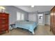 Bedroom featuring tiled floors, closet and views into the bright bathroom at 3420 Wild Oak Bay Blvd # 120, Bradenton, FL 34210