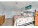 Bright bedroom features a patterned bed, light blue walls, and carpet flooring at 3420 Wild Oak Bay Blvd # 120, Bradenton, FL 34210