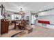 Well-lit dining room features tile flooring, stylish decor, and a dining table with seating and storage at 3420 Wild Oak Bay Blvd # 120, Bradenton, FL 34210
