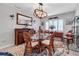 Bright dining space with a glass table, tropical rug, and stylish wooden accents and shutters at 3420 Wild Oak Bay Blvd # 120, Bradenton, FL 34210