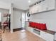 Foyer with tile floors, a built-in bench, overhead cabinets, and stylish decor at 3420 Wild Oak Bay Blvd # 120, Bradenton, FL 34210
