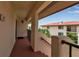 Hallway of condo featuring unit number 120, and a peek of the outdoors at 3420 Wild Oak Bay Blvd # 120, Bradenton, FL 34210